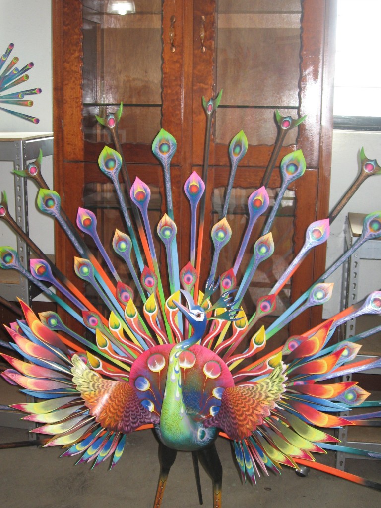 Marian Hubler spies a peacock in an alabrijes shop.